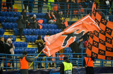 KHARKIV, UKRAINE - December 11, 2019: Flags in support of FC Shakhtar Donetsk with the team colors during the UEFA Champions League match between Shakhtar vs Atalanta BC (Italy), Ukraine