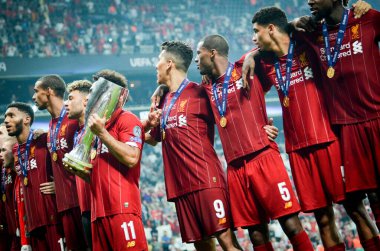 Istanbul, Turkey - August 14, 2019: Mohamed Salah celebrate victory with Liverpool  team and holdind trophy the UEFA Super Cup in Vodafone Arena, Turkey