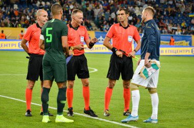 DNIPRO, UKRAINE - September 10, 2019: Judge tosses a coin  during the friendly match between national team Ukraine against Nigeria national team, Ukraine