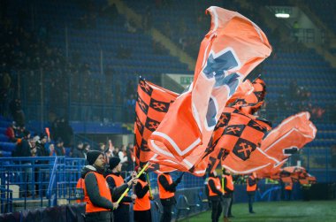 KHARKIV, UKRAINE - December 11, 2019: Flags in support of FC Shakhtar Donetsk with the team colors during the UEFA Champions League match between Shakhtar vs Atalanta BC (Italy), Ukraine
