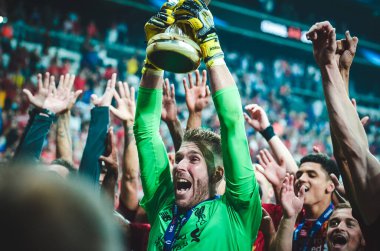 Istanbul, Turkey - August 14, 2019: Adrian celebrate victory and hold trophy UEFA Super Cup at Vodafone Park in Vodafone Arena, Turkey