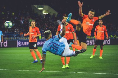 KHARKIV, UKRAINE - September 18, 2019: Nicolas Otamendi punches ball with scissors through herself during the UEFA Champions League match between Shakhtar vs Manchester City (England), Ukraine
