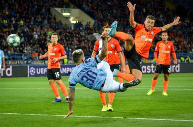 KHARKIV, UKRAINE - September 18, 2019: Nicolas Otamendi punches ball with scissors through herself during the UEFA Champions League match between Shakhtar vs Manchester City (England), Ukraine