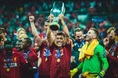 Istanbul, Turkey - August 14, 2019: Liverpool footballers celebrate victory at award ceremony during the UEFA Super Cup Finals match between Liverpool and Chelsea at Vodafone Park, Turkey