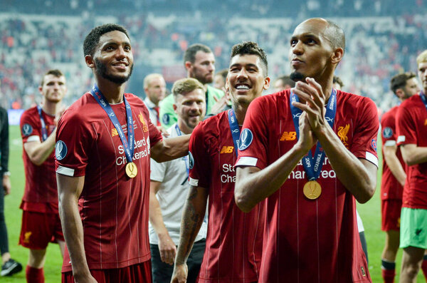 Istanbul, Turkey - August 14, 2019: Liverpool footballers celebrate victory at award ceremony during the UEFA Super Cup Finals match between Liverpool and Chelsea at Vodafone Park, Turkey