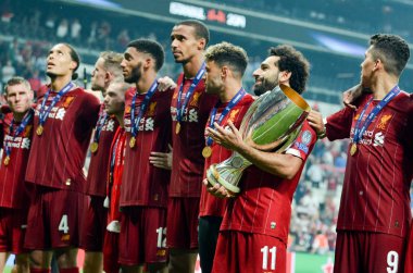 Istanbul, Turkey - August 14, 2019: Mohamed Salah celebrate victory with Liverpool  team and holdind trophy the UEFA Super Cup in Vodafone Arena, Turkey