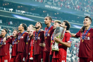 Istanbul, Turkey - August 14, 2019: Mohamed Salah celebrate victory with Liverpool  team and holdind trophy the UEFA Super Cup in Vodafone Arena, Turkey