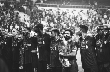 Istanbul, Turkey - August 14, 2019: Mohamed Salah celebrate victory with Liverpool  team and holdind trophy the UEFA Super Cup in Vodafone Arena, Turkey