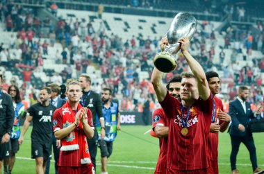 Istanbul, Turkey - August 14, 2019: James Milner holding trophy after the victory the UEFA Super Cup at Vodafone Park in Vodafone Arena, Turkey