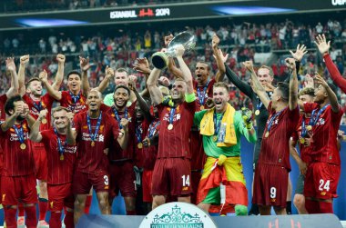 Istanbul, Turkey - August 14, 2019: Liverpool footballers celebrate victory at award ceremony during the UEFA Super Cup Finals match between Liverpool and Chelsea at Vodafone Park, Turkey