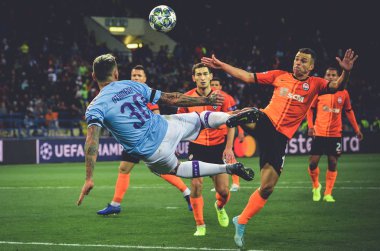 KHARKIV, UKRAINE - September 18, 2019: Nicolas Otamendi punches ball with scissors through herself during the UEFA Champions League match between Shakhtar vs Manchester City (England), Ukraine