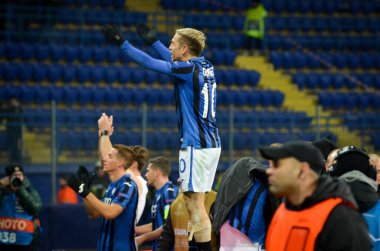 KHARKIV, UKRAINE - December 11, 2019: Papu Gomez celebrate victory with fans to the next round  UEFA Champions League, Ukraine