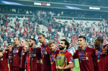 Istanbul, Turkey - August 14, 2019: Mohamed Salah celebrate victory with Liverpool  team and holdind trophy the UEFA Super Cup in Vodafone Arena, Turkey
