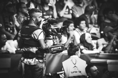 Istanbul, Turkey - August 14, 2019: TV operator with a camera during the UEFA Super Cup Finals match between Liverpool and Chelsea at Vodafone Park in Vodafone Arena, Turkey