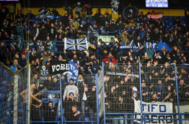KHARKIV, UKRAINE - December 11, 2019: Atalanta Bergamasca Calcio BC fans and ultras support their team during the UEFA Champions League match, Ukraine