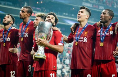 Istanbul, Turkey - August 14, 2019: Mohamed Salah celebrate victory with Liverpool  team and holdind trophy the UEFA Super Cup in Vodafone Arena, Turkey