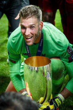Istanbul, Turkey - August 14, 2019: Adrian celebrate victory and hold trophy UEFA Super Cup at Vodafone Park in Vodafone Arena, Turkey