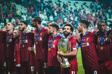 Istanbul, Turkey - August 14, 2019: Mohamed Salah celebrate victory with Liverpool  team and holdind trophy the UEFA Super Cup in Vodafone Arena, Turkey