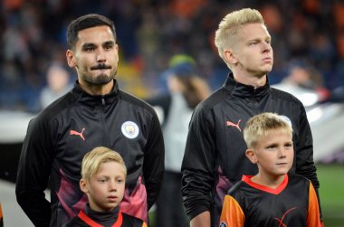 KHARKIV, UKRAINE - September 18, 2019: Oleksandr Zinchenko and Ilkay Gundogan during the UEFA Champions League match between Shakhtar Donetsk vs Manchester City, Ukraine