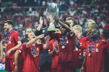 Istanbul, Turkey - August 14, 2019: Liverpool footballers celebrate victory at award ceremony during the UEFA Super Cup Finals match between Liverpool and Chelsea at Vodafone Park, Turkey