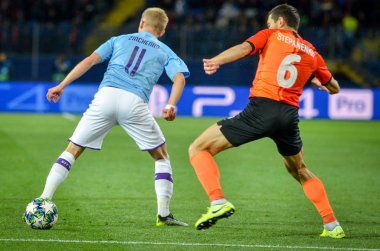 KHARKIV, UKRAINE - September 18, 2019: Oleksandr Zinchenko and Taras Stepanenko during the UEFA Champions League match between Shakhtar vs Manchester City, Ukraine
