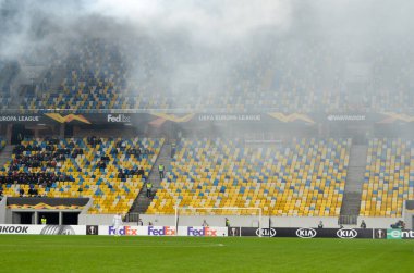 LVIV, UKRAINE - November 07, 2019: Stadium in the fog with a scoreboard during the UEFA Europa League match between Alexandria (Ukraine) vs AS Saint Etienne (France), Ukraine