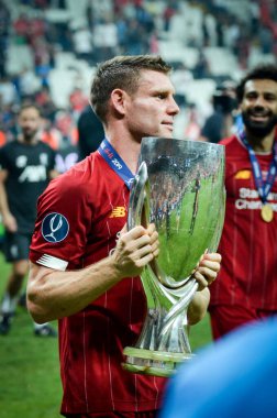 Istanbul, Turkey - August 14, 2019: James Milner holding trophy after the victory the UEFA Super Cup at Vodafone Park in Vodafone Arena, Turkey