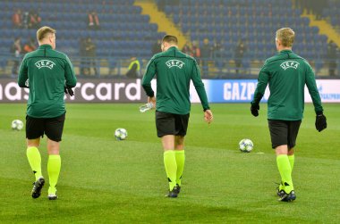 KHARKIV, UKRAINE - December 11, 2019: Referee Felix Zwayer and The refereeing panel of referees goes to workout during the UEFA Champions League match, Ukraine