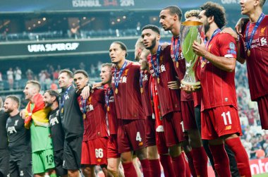 Istanbul, Turkey - August 14, 2019: Mohamed Salah celebrate victory with Liverpool  team and holdind trophy the UEFA Super Cup in Vodafone Arena, Turkey