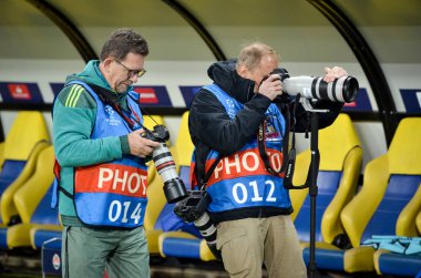 KHARKIV, UKRAINE - September 18, 2019: Journalists and photographers with a camera make report during the UEFA Champions League match, Ukraine