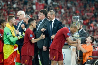 Istanbul, Turkey - August 14, 2019: Liverpool football players get gold medals during the UEFA Super Cup Finals match between Liverpool and Chelsea at Vodafone Park, Turkey