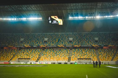 LVIV, UKRAINE - November 07, 2019: Night football stadium with light close up and general view during the UEFA Europa League match between Alexandria vs AS Saint Etienne (France), Ukraine