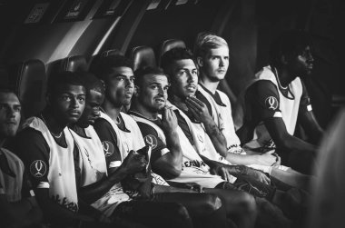 Istanbul, Turkey - August 14, 2019: Liverpool substitute footballers sit on bench before match during the UEFA Super Cup Finals match between Liverpool and Chelsea at Vodafone Park, Turkey
