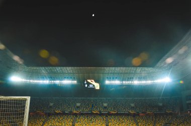 LVIV, UKRAINE - November 07, 2019: Night football stadium with light close up and general view during the UEFA Europa League match between Alexandria vs AS Saint Etienne (France), Ukraine