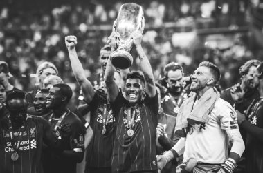 Istanbul, Turkey - August 14, 2019: Liverpool footballers celebrate victory at award ceremony during the UEFA Super Cup Finals match between Liverpool and Chelsea at Vodafone Park, Turkey