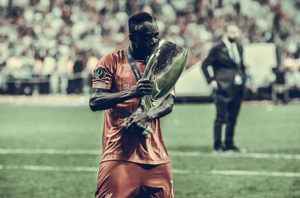 Istanbul, Turkey - August 14, 2019: Sadio Mane celebrates victory holding in his hands UEFA Super Cup after the match between Liverpool and Chelsea at Vodafone Park in Vodafone Arena, Turkey