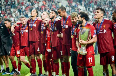 Istanbul, Turkey - August 14, 2019: Mohamed Salah celebrate victory with Liverpool  team and holdind trophy the UEFA Super Cup in Vodafone Arena, Turkey