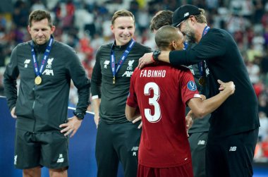 Istanbul, Turkey - August 14, 2019: Fabinho and  Jurgen Klopp during the UEFA Super Cup Finals match between Liverpool and Chelsea at Vodafone Park in Vodafone Arena, Turkey