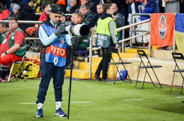 KHARKIV, UKRAINE - September 18, 2019: Journalists and photographers with a camera make report during the UEFA Champions League match, Ukraine