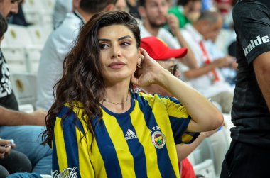 Istanbul, Turkey - August 14, 2019: Fan girl Galatasaray supports the team during the UEFA Super Cup Finals match between Liverpool and Chelsea at Vodafone Park in Vodafon Arena, Turkey