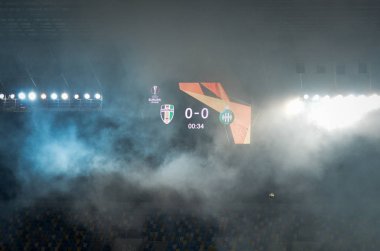 LVIV, UKRAINE - November 07, 2019: Stadium in the fog with a scoreboard during the UEFA Europa League match between Alexandria (Ukraine) vs AS Saint Etienne (France), Ukraine