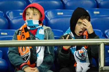 KHARKIV, UKRAINE - September 18, 2019: Football fans on the stadium support the team during the UEFA Champions League match between Shakhtar  vs Manchester City, Ukraine