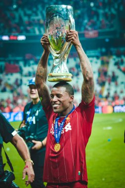 Istanbul, Turkey - August 14, 2019: Georginio Wijnaldum with trophy UEFA Super Cup Finals  at Vodafone Park in Vodafone Arena, Turkey