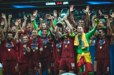 Istanbul, Turkey - August 14, 2019: Liverpool footballers celebrate victory at award ceremony during the UEFA Super Cup Finals match between Liverpool and Chelsea at Vodafone Park, Turkey