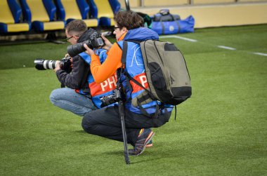 KHARKIV, UKRAINE - September 18, 2019: Journalists and photographers with a camera make report during the UEFA Champions League match, Ukraine