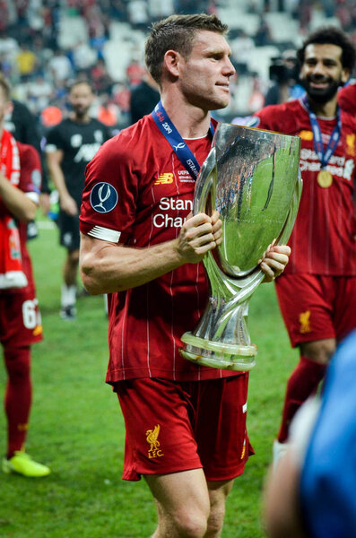 Istanbul, Turkey - August 14, 2019: James Milner holding trophy after the victory the UEFA Super Cup at Vodafone Park in Vodafone Arena, Turkey