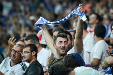 Istanbul, Turkey - August 14, 2019: Chelsea Football fans and spectators celebrate goal scored during the UEFA Super Cup Finals match between Liverpool and Chelse, Turkey