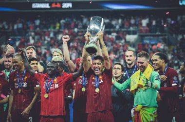 Istanbul, Turkey - August 14, 2019: Liverpool footballers celebrate victory at award ceremony during the UEFA Super Cup Finals match between Liverpool and Chelsea at Vodafone Park, Turkey