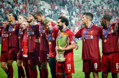 Istanbul, Turkey - August 14, 2019: Mohamed Salah celebrate victory with Liverpool  team and holdind trophy the UEFA Super Cup in Vodafone Arena, Turkey