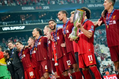Istanbul, Turkey - August 14, 2019: Mohamed Salah celebrate victory with Liverpool  team and holdind trophy the UEFA Super Cup in Vodafone Arena, Turkey